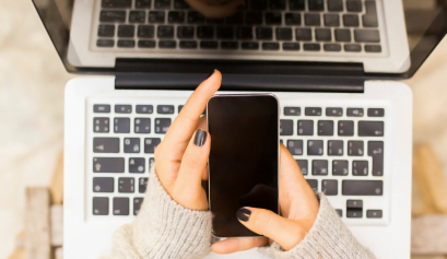 A beauty pro scrolls through her Instagram as she plans her Instagram marketing strategy.
