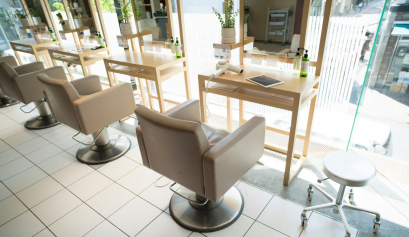 An empty hair salon is shown, in an attempt to fill more chairs in the salon, they're updating their facebook marketing strategy.