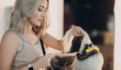 A client gets a new beauty service at her favorite salon.