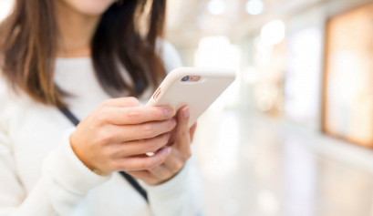 A client books an appointment on a digital booking service for her favorite salon.