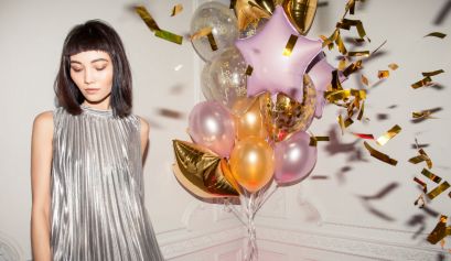 A client shows off her NYE look thanks to her beauty pro.