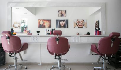 A salon–currently empty with three pink chairs–undergoes a salon structure audit.