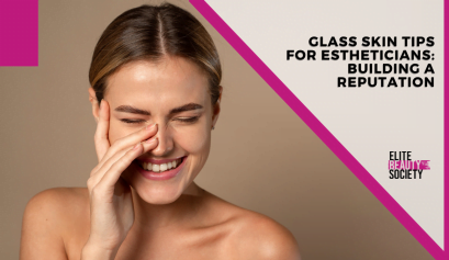 A client smiles and touches her face after her glass skin treatment from her esthetician.