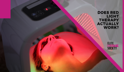 A client lays under a red light for a therapy session, though she does wonder: does red light therapy work?